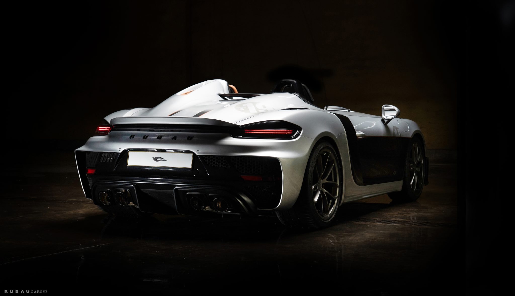 Silver Rubau Speedster seen from the rear in the studio